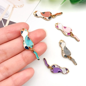 Five colorful enamel cat charms for DIY jewelry making in blue, orange, pink, grey and purple