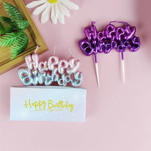 Gradient galaxy love birthday candles in purple and pink-blue with gold speckles