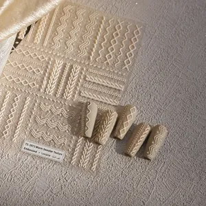 Macro detail of 3D embossed sweater texture nail art stickers with knit pattern TS-3973