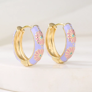 Golden huggie hoop earrings with purple enamel and pink daisy flower pattern