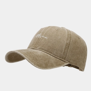 Detail of embroidered Mama text on washed khaki cotton vintage baseball cap