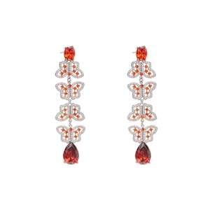 Vintage zircon butterfly tassel earrings with red pear-cut gemstone drops on white background