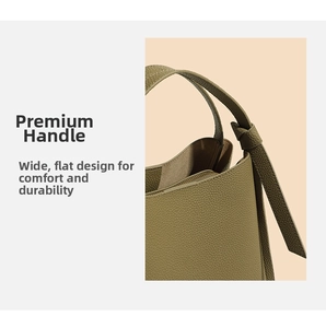 Detail view of olive green leather bucket bag featuring a wide handle and leather knot detail
