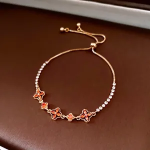 Adjustable 18K gold plated bracelet with orange marquise flower motifs for women