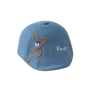 Blue cotton baby beret featuring brown bear embroidery and white Bear lettering