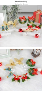 Macro detail of Christmas mini cake toppers featuring holly leaves, wreaths and festive bells