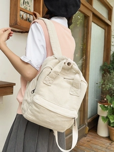 Fashionable beige corduroy backpack for women with adjustable straps and front pocket