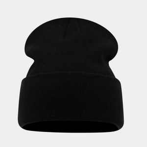 Close-up of fine knit texture on a black cuffed beanie made of high elastic warm fabric