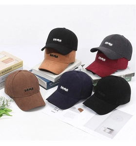 Detail of multi-color corduroy baseball caps with premium 'some' letter embroidery