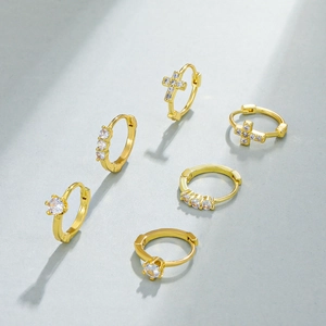 Golden hoop earrings set with sparkling cubic zirconia and cross pendant for women