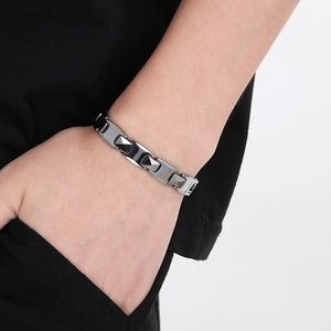 Macro shot of gunmetal tungsten steel bracelet featuring geometric prism link design