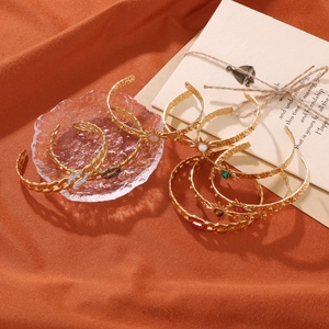 Gold stainless steel C-shaped open bangles featuring natural stones and zircon accents