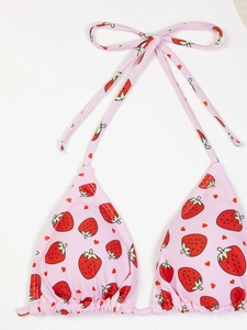 Detail of pink strawberry print bikini top with halter neck ties and ruched cups