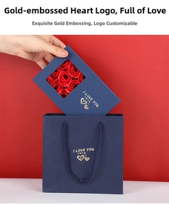 Macro shot of dark blue gift bag and window box with gold heart foil stamping