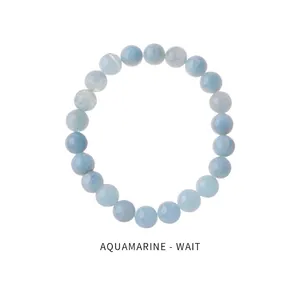 Detail view of natural light blue aquamarine beaded bracelet with translucent texture