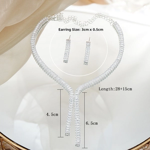 Detail view of silver bridal jewelry set with rectangular zircon fringe necklace and earrings