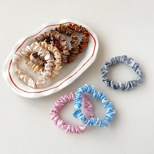 Set of 7 small silk satin scrunchies in neutral earth tones and pastel colors