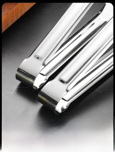 Close-up of seamless stainless steel food tongs with one-piece molding construction