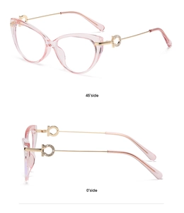 Detail view of pink cat-eye glasses with gold metal temples and rhinestone accents