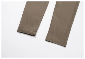 Detail view of ribbed brown yoga pants with high-quality double-needle hem stitching
