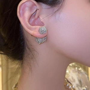 Elegant silver square cubic zirconia earrings worn by model in a stylish side view profile