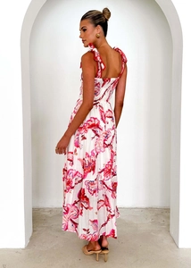 Detail of adjustable tie-up shoulder straps and back smocking on floral maxi dress