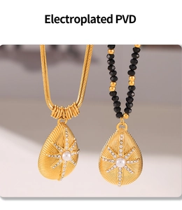 Detail of PVD plated gold necklaces featuring starburst pendants with pearl and bead chains
