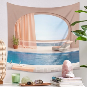 Detail view of pink bohemian pool tapestry hanging on a wall with home decor accessories