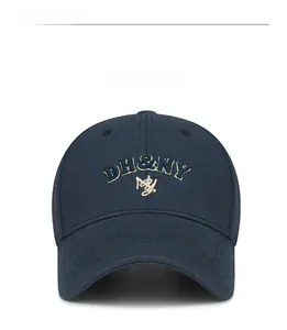 Detail of navy blue baseball cap featuring high-quality DH&NY 3D letter embroidery