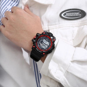 Wrist shot of a black and red sports digital watch showing the WR30M waterproof feature