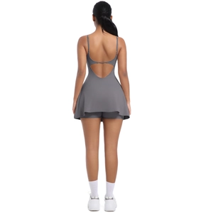 Detail of cross-back straps and hollow waist design on dark gray athletic dress
