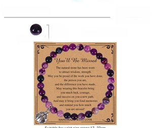 Purple striped agate bead bracelet with ladybug charm on 'You'll Be Missed' card