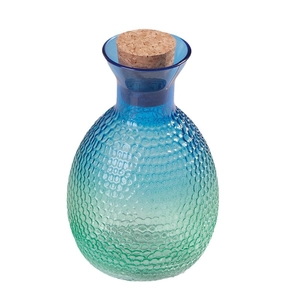 Peacock blue gradient hammered glass sake bottle with cork stopper on white background