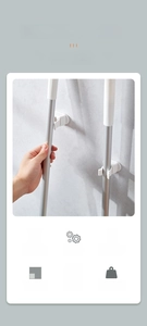 Detail of wall-mounted mop holder showing waterproof adhesive and strong grip mechanism