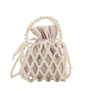 French vintage beaded bucket bag with white faux pearl mesh and linen drawstring pouch