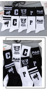 Detail of cotton mid-calf socks featuring black and white sport style with letter prints