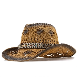 Brown hollow-out straw cowboy hat with ethnic style ribbon and wide sun protection brim