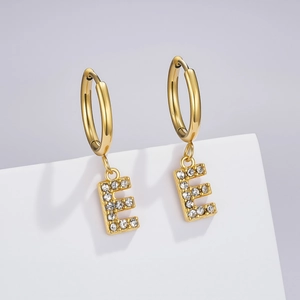 Detailed view of a gold plated letter E earring charm with pave set clear cubic zirconia