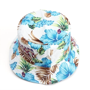 Detailed texture of tropical reversible bucket hat with blue floral and leaf print