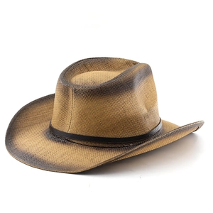 Detail of hand-woven western straw hat with vintage gradient finish and leather band