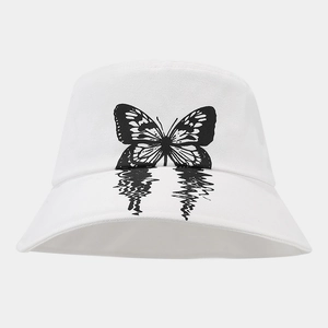 Close-up of white cotton bucket hat with black butterfly print and neat stitching detail