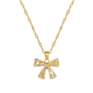 Luxurious gold titanium steel necklace featuring a crystal bow pendant on a fine link chain