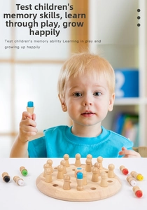 Close-up of a child playing with a round wooden memory chess game for cognitive training
