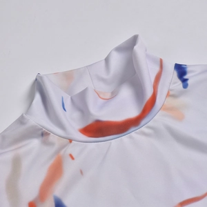 Detail of high neck bodysuit with orange and blue abstract print and knit texture