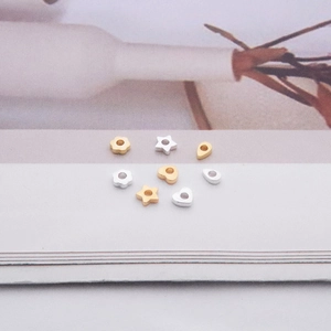 Detailed view of S925 sterling silver beads in star, heart and flower shapes for DIY jewelry