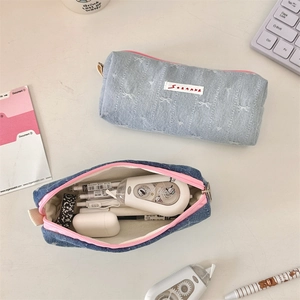 Dual denim bow pencil cases with pink zippers and large storage capacity for stationery