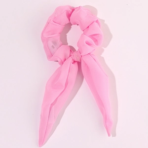Detail of pink LED light-up scrunchie with ribbons in soft glowing translucent fabric