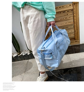 Detail of blue nylon travel bag with wet-dry separation showing spacious interior design