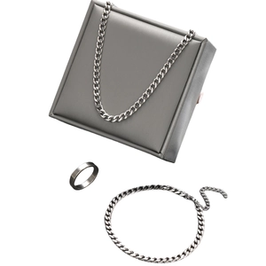 Minimalist stainless steel jewelry set with chain necklace, bracelet and ring on gift box