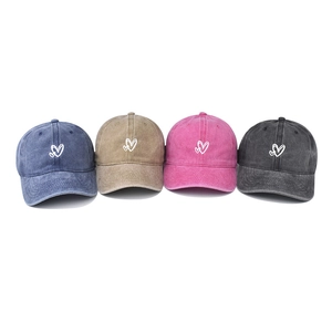 Washed vintage baseball caps with heart embroidery in navy, khaki, pink, and grey